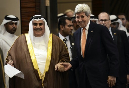 Bahrain's foreign minister Sheikh Khaled bin Ahmed al-Khalifa (left) pictured with US Secretary of State John Kerry in Manama on April 7, 2016. - AFP Photo