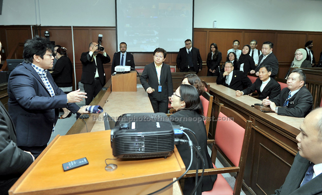Azalina (left) during her official visit to the Kuching Court complex. — Bernama photo