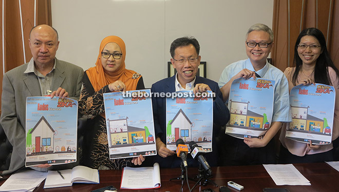 From left: Dr Andrew, Dr Jamilah, Dr Sim, Dr Chua, and Dr Lee showing posters on eliminating breeding places of mosquitoes during the press conference.