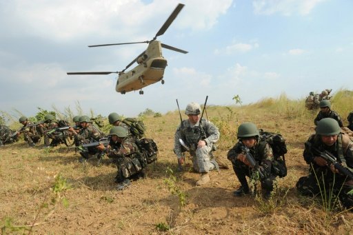 Philippine and US soldiers take part in an air assault exercise inside the military training camp of Fort Magsaysay, north of Manila -AFP photo