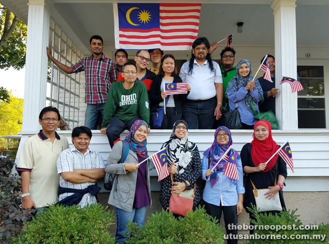 Jayum (second row, second right) welcoming the graduate student delegates from Malaysia at his home where he hosted them for dinner.