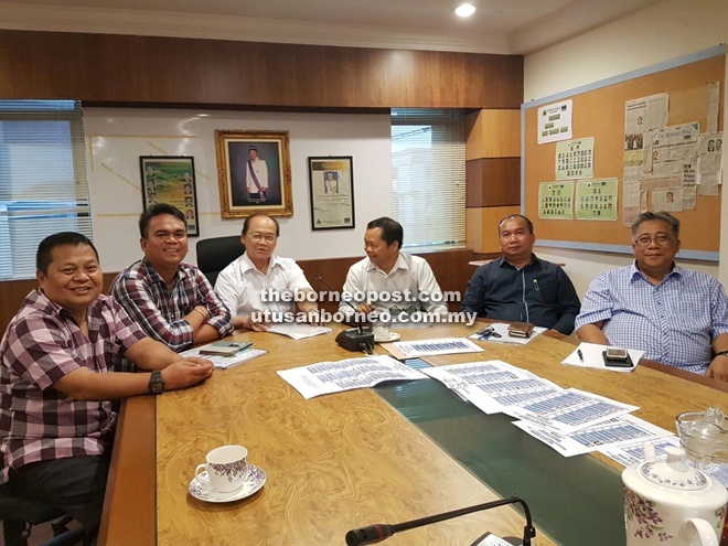 Nissom (fourth from right) and Edward, on his left, and other election committee members at the meeting.