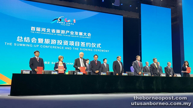 Lee (fourth from left, front row) and Abdul Wahab (third from left) pose for a photo after the MoU signing in Baoding, Hebei Province, China, recently. 