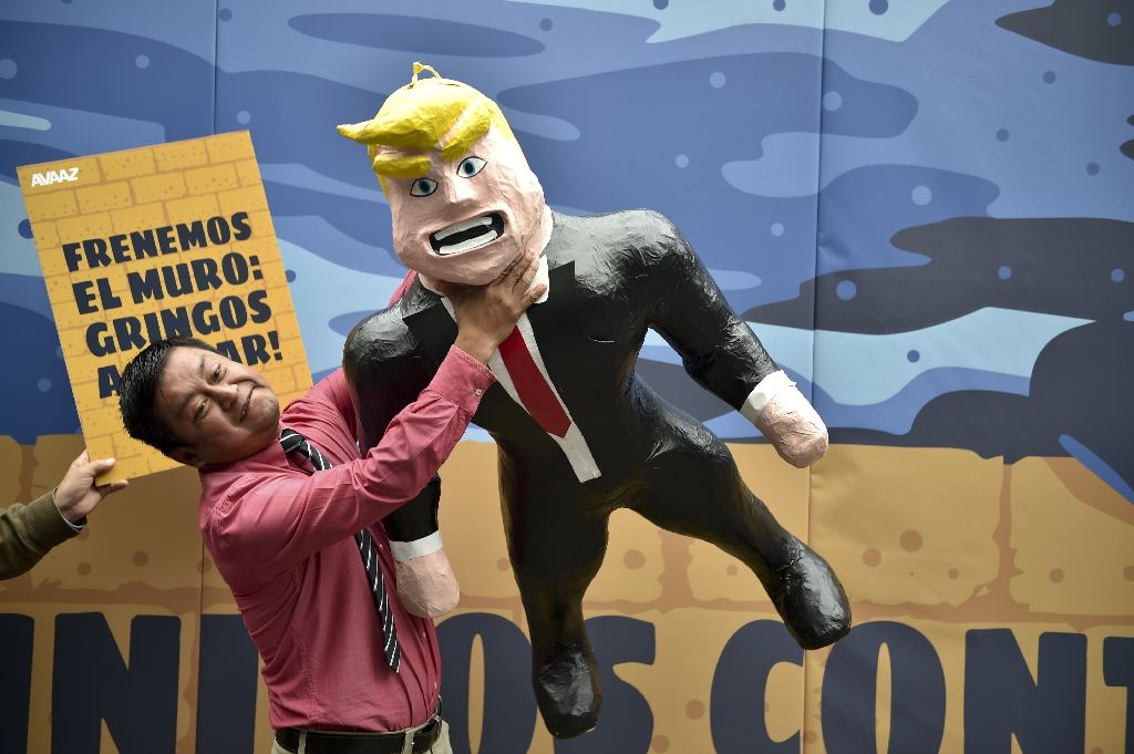 A Mexican protests against US Republican presidential candidate Donald Trump in front of a specially made scenery wall during an AVAAZ-organized rally at the Angel of Independence Square in Mexico City on Sept 25, 2016. AFP Photo