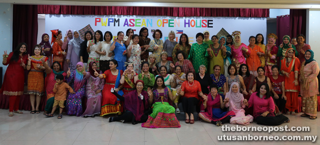 One big family of PWPM members in a photocall during the PWPM Asean open house. With them is Liz Durkin (seated back row – centre), wife of Simon Durkin, managing director of Sarawak Shell Berhad (SSB). — Photos by Cecilia Sman. 