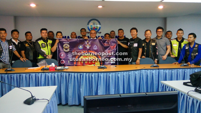 (From front sixth left) Azhari and Yii join Permaisuri Riders Motor Club members to promote the event. 