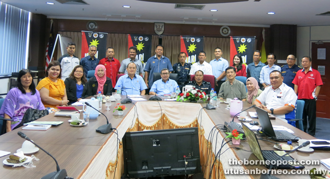 Dr Anthony (seated fifth right) with Lim (seated fifth left), Mat Jusoh (seated fourth right), Johari (seated far right) and other committee members after the meeting.