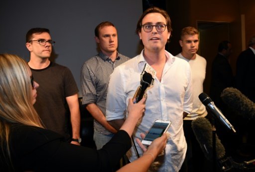 Nick Kelly (C) from the group of nine dubbed the 'Budgie Nine' speaks to the media after arriving at Sydney Airport -AFP photo