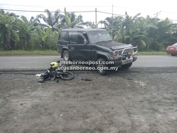 The victim's motorcycle and Toyota Prado at the scene of the accident at Km 18, Jalan Lahad Datu-Tungku.