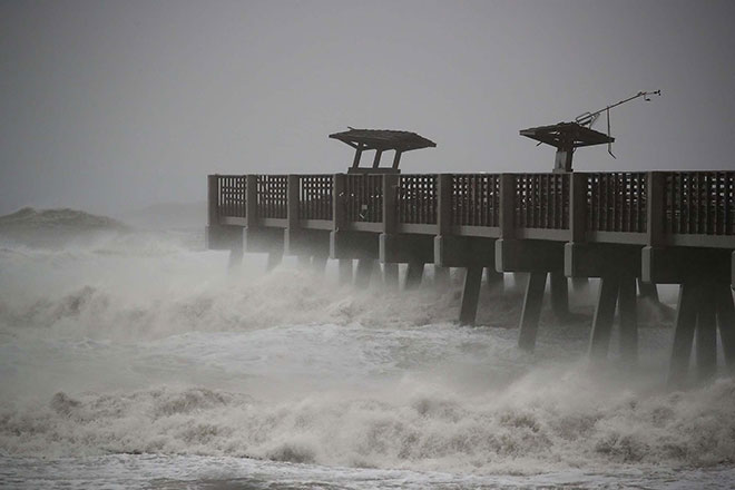 Large waves caused by Hurricane Matthew pound the Jacksonville Pier and was damaged by the storm in Jacksonville Beach, Florida. — AFP photo