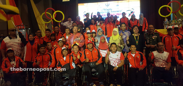 Jamilah, Fatimah and other officials seen with the state Paralympic teams, one of the nine state teams which competed in the recently concluded Malaysian Paralympiad Games during yesterday’s ceremony at the Baitulmal Building.