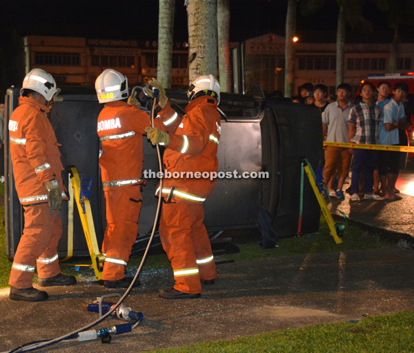 File picture shows fire-fighters rescuing a ‘trapped victim’ during a fire point programme. 