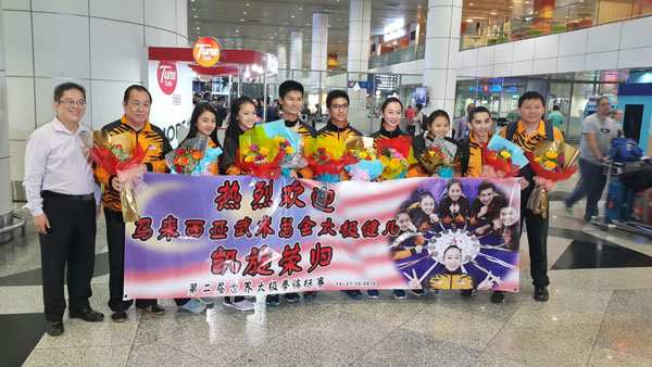 The Malaysian wushu team receiving a warm welcome from WFM representatives at the KLIA on Saturday.