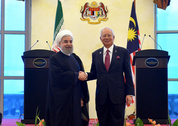 Najib (right) welcomes Rouhani during his courtesy call. — Bernama photo