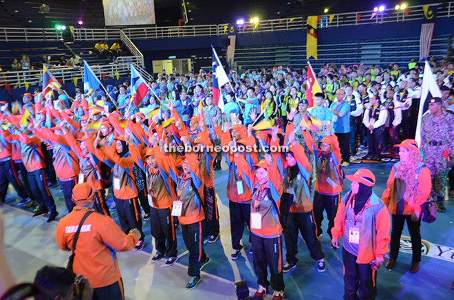 The Sarawak contingent leading the other states in a war cry during the opening ceremony.