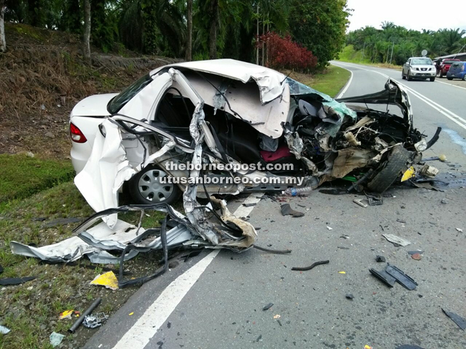 The badly damaged Proton Saga after colliding with the express bus. 