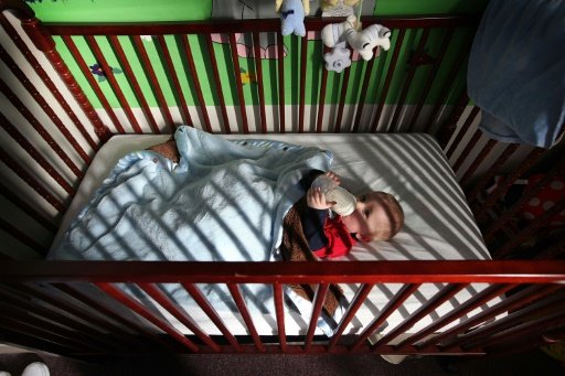 Babies should sleep in the same room as their parents but in their own crib or bassinet for the first year of life, according to the American Academy of Pediatrics. AFP File Photo