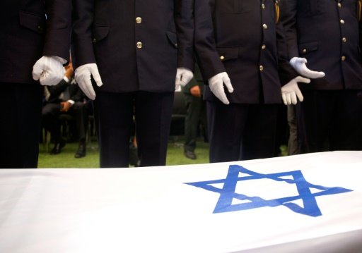 Members of the Knesset (parliamentary) guards stand beside the flag-draped coffin of former Israeli President Shimon Peres during the burial ceremony at the funeral at Mount Herzl National Cemetery by Daphne Rousseau | AFP photo