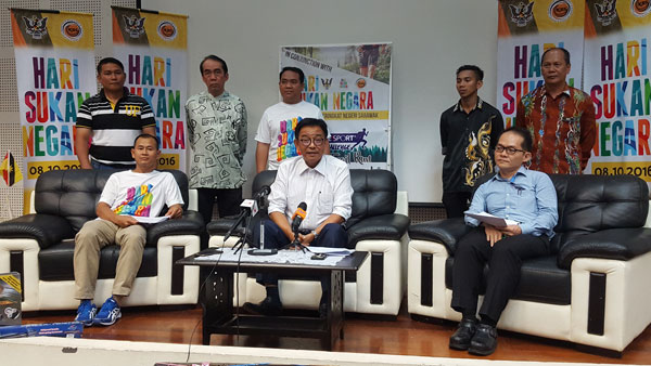 Karim (seated centre) seen speaking to reporters during the press conference yesterday. Also seen are Zaini (seated left), Liew (seated right) and others. 