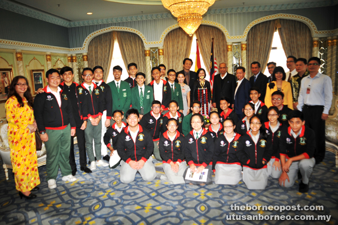 Adenan (eighth right) posing for a group photo with SMK St Joseph Marching Band who did Sarawak and Malaysia proud at the recent USBands Yamaha Cup Competition held at Metlife Stadium in New Jersey, USA last month. — Penerangan photos 