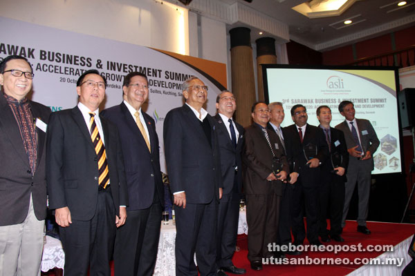 Adenan (fourth left) at the launch of the 3rd Sarawak Business and Investment Summit. On his left is Works Minister Datuk Seri Fadillah Yusof.