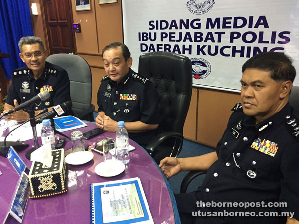 Mazlan (centre) addressing reporters during the press conference, flanked by State Police Deputy Commissioner Datuk Abdul Aziz Yusof (right) and Kuching police chief ACP Abang Ahmad Abang Julai.