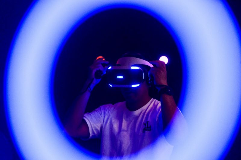 A man plays a Sony Playstation virtual reality game at the annual Ani-Com show in Hong Kong on July 29, 2016. AFP Photo
