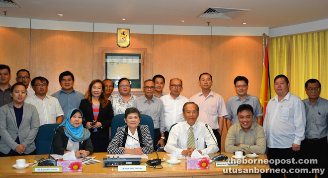 Ting (seated second left) and Tiong (second right) with SMC officials and members of the campaign committee at the press conference.