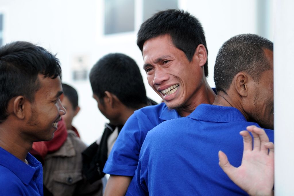 The relief of 26 freed Somali pirate hostages held for almost five years was palpable, with some unable to hold back tears while others hugged each other and smiled broadly as they arrived in Kenya on Oct 23, 2016. AFP Photo