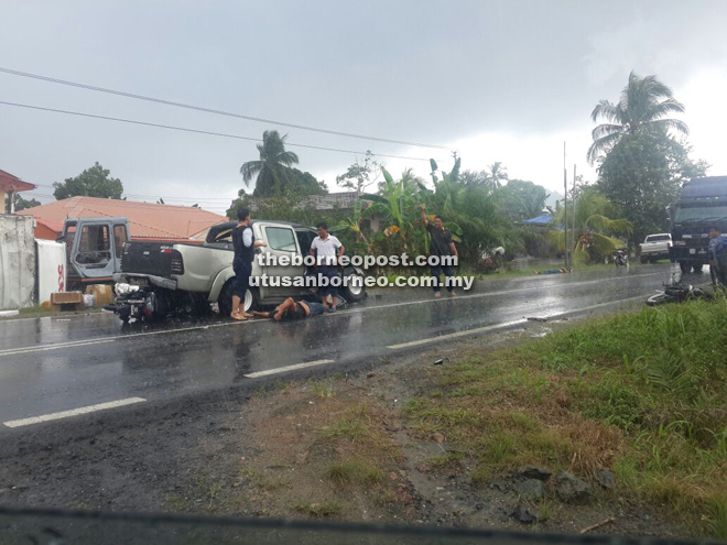 The scooter that crashed into the back of the Toyota Vigo with its injured rider lying on the road.