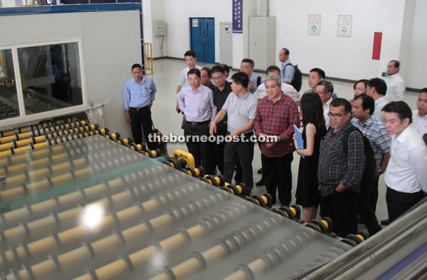 The Sarawak delegation visits the Irico photovoltaic glass manufacturing plant. Awang Tengah is at front third right.