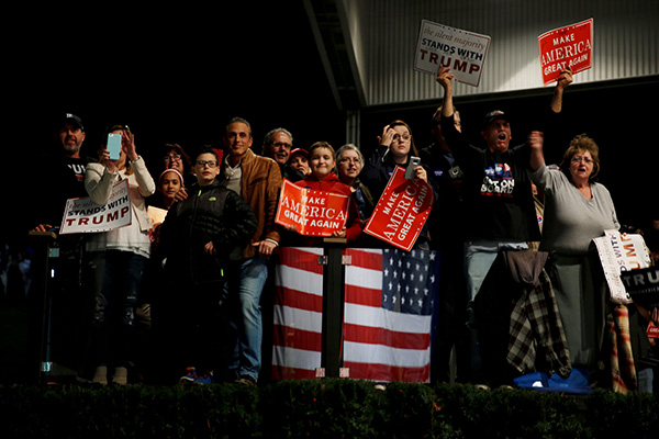 Supporters cheer for Trump at a campaign rally in Detroit, Michigan Nov 6. Most Trump voters are not bigots nor do they fit in ‘a basket of deplorables’. These Americans felt the ground sinking beneath their feet as rising costs of living and lack of employment opportunities in middle-America permeated the rust-belt states with an air of anger, frustration and desperation. — Reuters photo