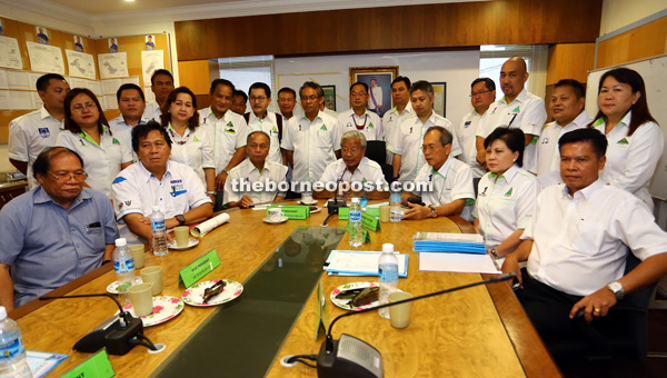 Masing (seated centre) flanked by PRS secretary general Dato Joseph Salang (right) and other supreme council members at the press conference yesterday. — Photo by Muhamad Rais Sanusi