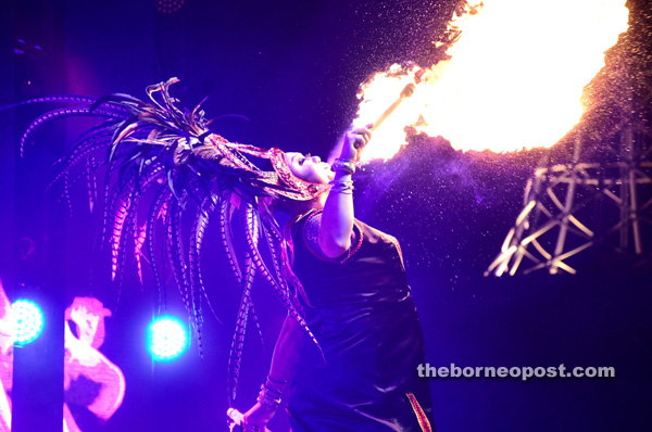 A participant wowing the audience with her fire act.