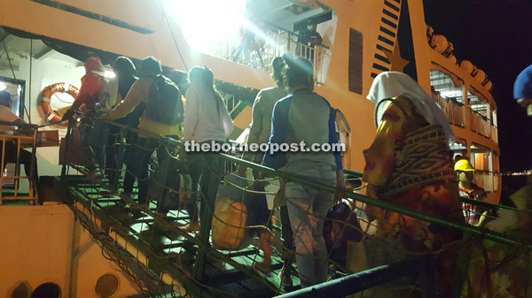 Some of the 450 illegal immigrants boarding a ship to Zamboanga at Sandakan Port.