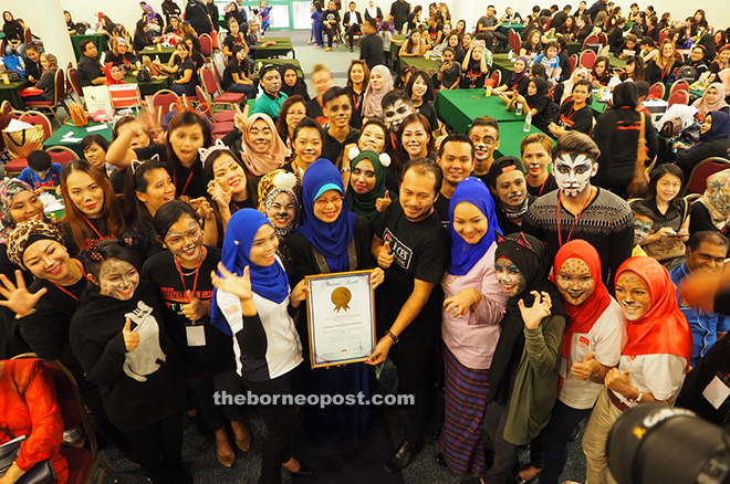 Fatimah (front, sixth right) is seen during a photo call with (front, from third left) Nurasyikin, Nicholas, and Noriah. 