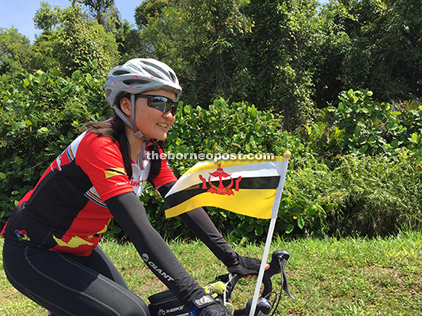 Voon on her bike, passing through Brunei.