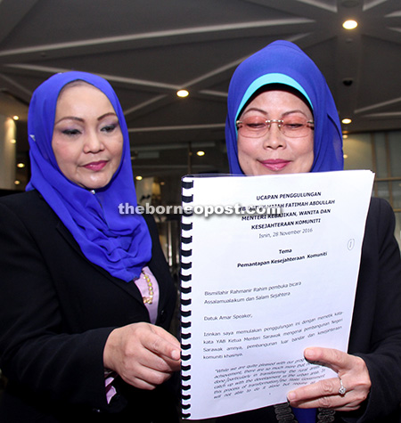 ALL READY: Welfare, Women and Community Wellbeing Minister Datuk Fatimah Abdullah (right) goes through her text of speech together with the state Family and Women Department director Noriah Ahmad.