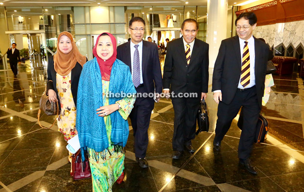 A GOOD DAY: Assistant Minister for Solidarity Rosey Yunus walking towards the entrance of the DUN with (from left, background) Lingga assemblywoman Simoi Peri, Assistant Minister for Industrial Development Datuk Julaihi Narawi, Assistant Minister for Environment Datu Len Talif Salleh and Assistant Minister for Rural Economy and Plantation Datuk Francis Harden following from behind.