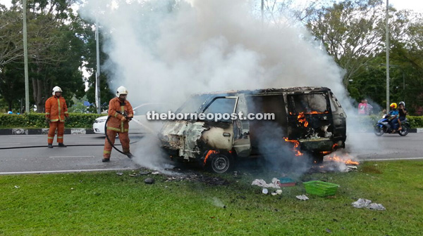 Firemen dousing the flames upon arrival at the scene.