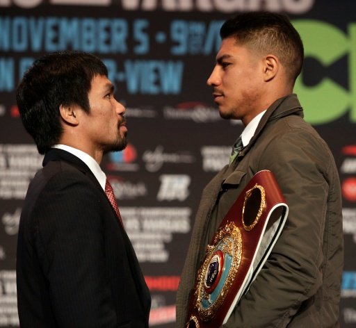 Boxers Manny Pacquiao (L) of the Philippines and Jessie Vargas of the US face off during their final news conference at The Wynn Las Vegas on Nov 2, 2016. AFP Photo