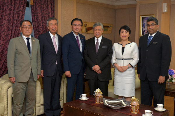 Ahmad Zahid (third right) with Keiji (third left) and his delegation in a group photo. — Bernama photo