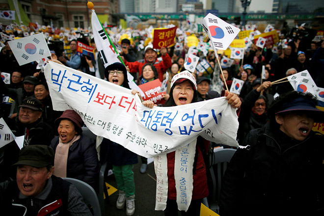 Supporters of Park Geun-hye chant slogans during a rally opposing calls for her resignation, in Seoul. The banner reads ‘There is no better president than Park Geun-hye!’.  — Reuters photo