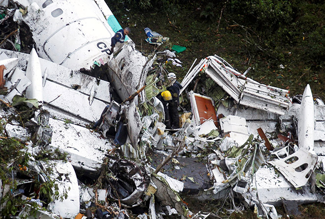 Rescue crew work in the wreckage from a plane that crashed into Colombian jungle with Brazilian soccer team Chapecoense near Medellin, Colombia. — Reuters photo