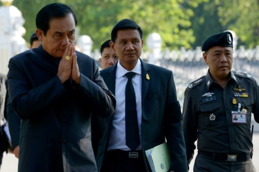 Thai Prime Minister Prayut Chan-O-cha (L) arrives at Government House in Bangkok on Nov 29, 2016. AFP Photo