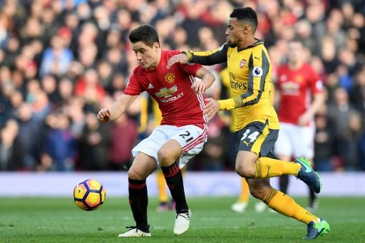 Manchester United's Spanish midfielder Ander Herrera (L) vies with Arsenal's French midfielder Francis Coquelin during the English Premier League football match between Manchester United and Arsenal on Nov 19, 2016. AFP File Photo