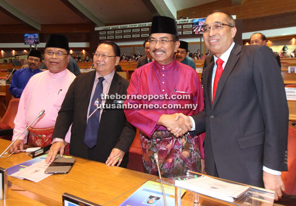 CM Datuk Seri Musa Aman (second right) being congratulated by Datuk Seri Dr Salleh Tun Said as DCM Datuk Yahya Hussin (left) and Tan Sri Joseph Pairin Kitingan (second left) look on before the State Assembly sitting started.