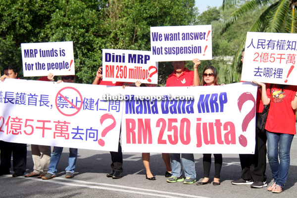 Several participants carrying placards asking where the RM250 million in MRP fund has gone to during the peaceful protest. - Photo by Chimon Upon