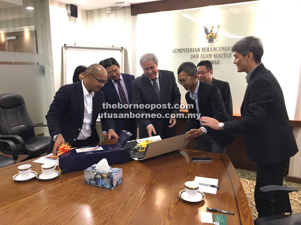 Awang Tengah (fourth right) with the visitors and his senior officers.