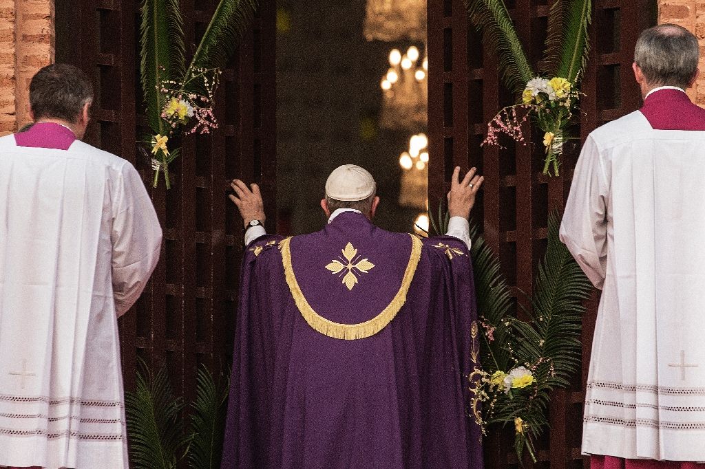 Pope Francis eschewed tradition to open the first of the "Holy Door" not at Saint Peter's but in the cathedral of Bangui in the Central African Republic. AFP Photo